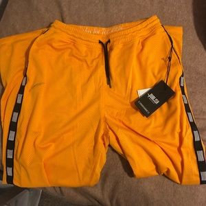 Men’s yellow track pants